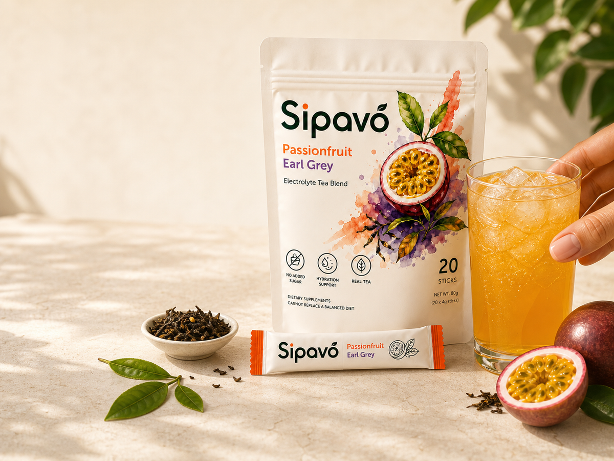 Sipavó Passionfruit Earl Grey electrolyte sticks beside iced tea